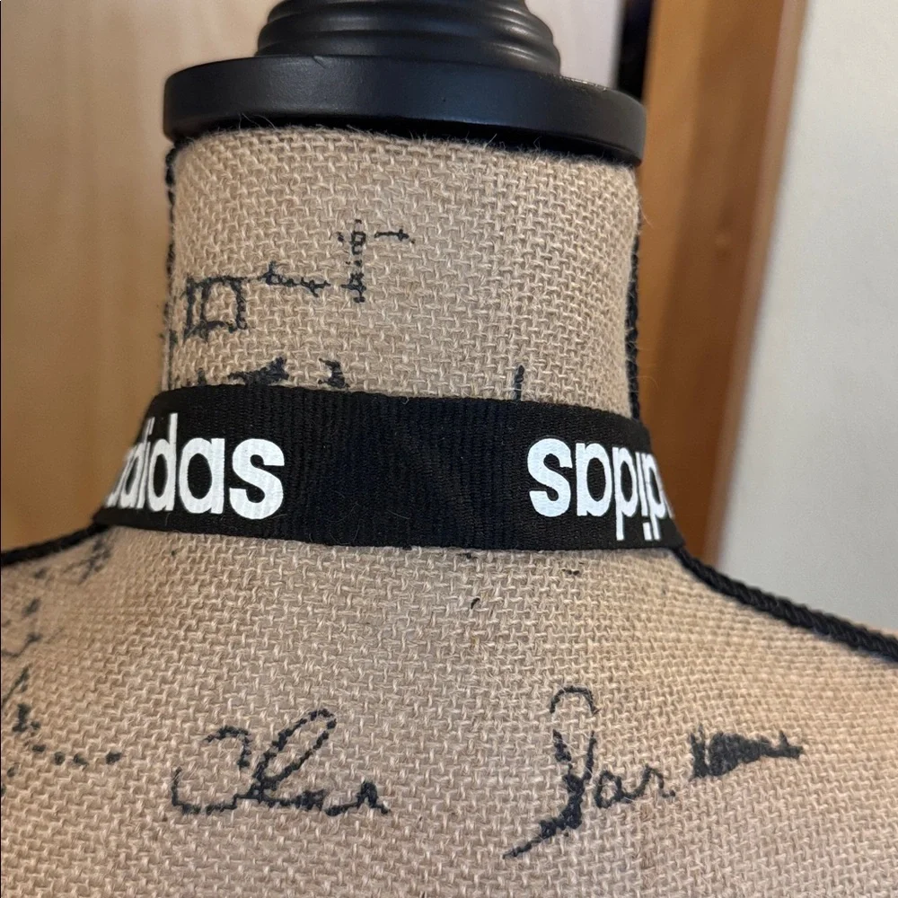 Barely used authentic ADIDAS lanyard with pinch clip off section on bottom.